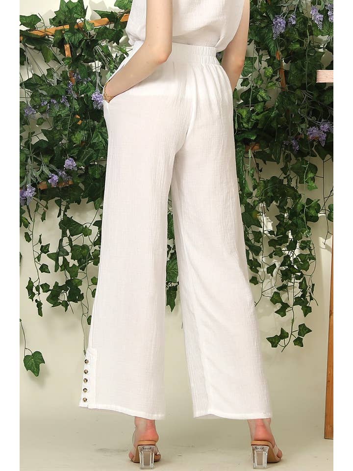 BANDED SMOCKING LONG PANTS WITH BUTTON DETAILED