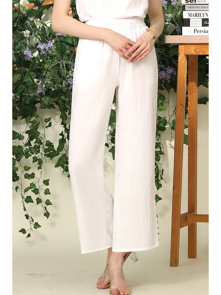 BANDED SMOCKING LONG PANTS WITH BUTTON DETAILED